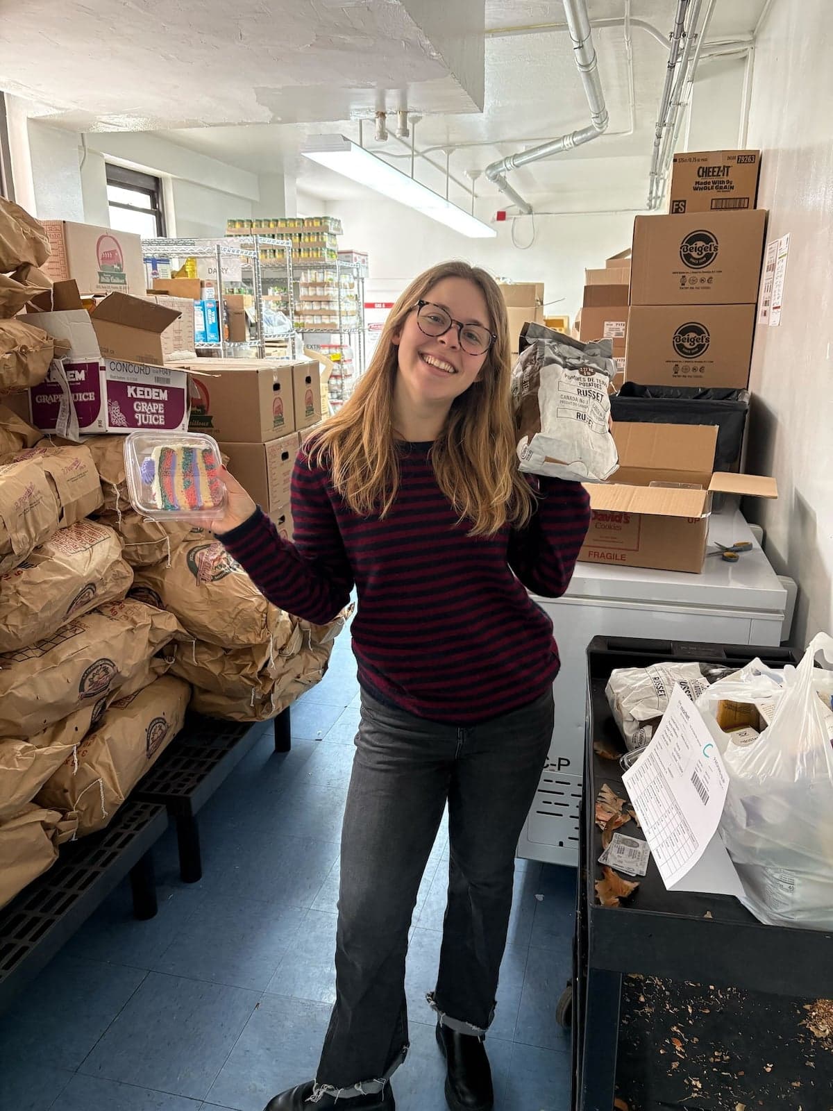 2025-2026 Avodah NYC Corps Member at working at UCJES's food pantry